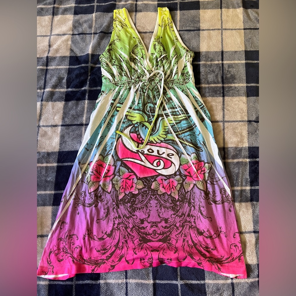 This Y2K-style bohemian dress features a "tattoo print" design with graphics